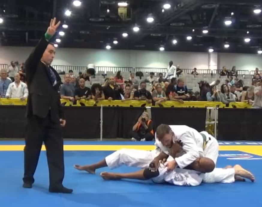 michael wrapping up opponent with lapels to score guard pass 
